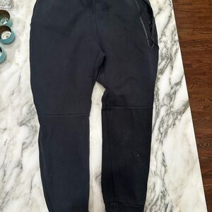 Grey and black Nike tech pants men’s medium